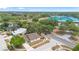 Aerial view of a home situated in a lush neighborhood close to a school with blue roofing at 4636 Fern Pine Dr, Orlando, FL 32808