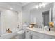 Updated bathroom with tub/shower combo, modern vanity, and neutral tiling at 4636 Fern Pine Dr, Orlando, FL 32808