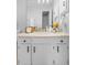 Bathroom featuring modern vanity with neutral tiling and updated fixtures at 4636 Fern Pine Dr, Orlando, FL 32808