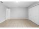 Bedroom with tile flooring, closet, and neutral paint at 4636 Fern Pine Dr, Orlando, FL 32808