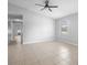 Spacious bedroom with tile floors, neutral walls, and lots of natural light, offering a serene and comfortable retreat at 4636 Fern Pine Dr, Orlando, FL 32808