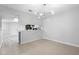 Dining room with tile flooring, modern light fixture, and a view of the kitchen at 4636 Fern Pine Dr, Orlando, FL 32808
