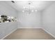 Cozy dining room with modern light fixture and neutral walls at 4636 Fern Pine Dr, Orlando, FL 32808