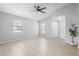 Inviting living room with tile flooring, neutral walls, and abundant natural light, creating a welcoming atmosphere at 4636 Fern Pine Dr, Orlando, FL 32808