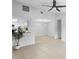 Bright living room features tile floors and neutral walls, showcasing an open layout and airy atmosphere at 4636 Fern Pine Dr, Orlando, FL 32808