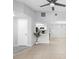 Bright living room boasts tile floors, neutral walls, and a view into the kitchen, creating an open and airy space at 4636 Fern Pine Dr, Orlando, FL 32808