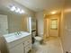 Bathroom with large vanity, modern fixtures, toilet, and walk-in shower at 5050 Hidden Springs Blvd, Orlando, FL 32819