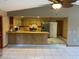 Kitchen with a breakfast bar, stainless steel appliances, and ample cabinet space at 5050 Hidden Springs Blvd, Orlando, FL 32819