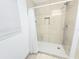 Tiled bathroom with shower head, curtain, and niche at 509 Grove Ave, Orlando, FL 32805