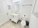 Bathroom featuring a modern vanity, mirror, updated lighting, and toilet at 509 Grove Ave, Orlando, FL 32805