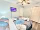 Inviting bedroom featuring a mounted TV, closet and serene decor for a relaxing space at 509 Grove Ave, Orlando, FL 32805