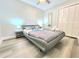 Bedroom with laminate flooring, closet, and modern bedframe at 509 Grove Ave, Orlando, FL 32805