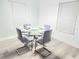 Modern dining area with a glass table and seating for four, bathed in natural light at 509 Grove Ave, Orlando, FL 32805