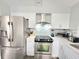 Modern kitchen features stainless appliances, white cabinets, and stylish countertops at 509 Grove Ave, Orlando, FL 32805