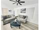Inviting living room featuring gray sofas, a modern fan, and stylish accents at 509 Grove Ave, Orlando, FL 32805