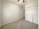 This bedroom includes carpeted floors and a double door closet at 5236 Shale Ridge Trl, Orlando, FL 32818