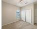 Bright bedroom featuring neutral walls, carpeted floors, and a window for natural light at 5236 Shale Ridge Trl, Orlando, FL 32818