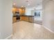 Open kitchen features stainless steel appliances, tile flooring and wooden cabinets at 5236 Shale Ridge Trl, Orlando, FL 32818
