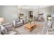 Cozy living room features neutral tones, plush seating, and abundant natural light at 5236 Shale Ridge Trl, Orlando, FL 32818