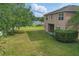 Lush backyard, fenced, with covered patio and plenty of room for activities at 5525 Oakworth Pl, Sanford, FL 32773