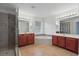Spacious bathroom with dual sinks, tiled shower, soaking tub, and tile flooring at 5525 Oakworth Pl, Sanford, FL 32773