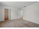 Carpeted bedroom with a closet and doorway at 5525 Oakworth Pl, Sanford, FL 32773