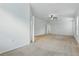 Large bedroom with neutral carpet, ceiling fan, and bright natural light at 5525 Oakworth Pl, Sanford, FL 32773