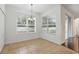 Cozy dining area with tile floors, large windows, and a sliding door to the patio at 5525 Oakworth Pl, Sanford, FL 32773