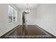 Elegant dining room featuring hardwood floors, a modern chandelier, and an open layout perfect for entertaining at 5525 Oakworth Pl, Sanford, FL 32773