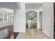 Inviting entryway featuring tiled floors, arched doorways, and views into the adjacent living and dining spaces at 5525 Oakworth Pl, Sanford, FL 32773