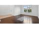 Bright living room features dark hardwood floors, plenty of natural light and neutral paint at 5525 Oakworth Pl, Sanford, FL 32773