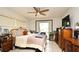 Cozy bedroom with traditional furniture, a ceiling fan, and natural light at 6105 Lost Tree Court, Orlando, FL 32808