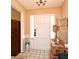 View of entryway with neutral walls, chandelier, white door, and boxes stacked near the entrance at 6105 Lost Tree Court, Orlando, FL 32808