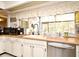 Bright kitchen with stainless steel appliances, wood countertops, and a view of the backyard at 6105 Lost Tree Court, Orlando, FL 32808