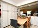 Open-concept kitchen and dining area featuring ample cabinet space and a seamless connection to living spaces at 6105 Lost Tree Court, Orlando, FL 32808