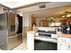 Modern kitchen featuring stainless steel appliances, a breakfast bar, and an open view to the living room at 6105 Lost Tree Court, Orlando, FL 32808