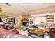 Open-concept living room showing tile floors, fireplace, and access to the kitchen at 6105 Lost Tree Court, Orlando, FL 32808