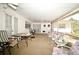 Covered patio with ample seating and a view of the backyard at 6105 Lost Tree Court, Orlando, FL 32808