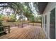 Wooden deck with railing offering an ideal space for outdoor lounging and entertaining at 6345 Hatcher Rd, Lakeland, FL 33811