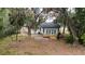 Beautiful backyard featuring a new deck, mature trees, and a serene, private outdoor space at 6345 Hatcher Rd, Lakeland, FL 33811