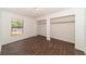 Bright bedroom with wood-look tile flooring and a window at 6345 Hatcher Rd, Lakeland, FL 33811