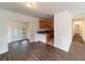 Dining Room featuring dark wood floors with kitchen view and access to back yard at 6345 Hatcher Rd, Lakeland, FL 33811