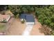 Quaint single-Gathering home with a two-car garage, lovely front lawn, and mature trees offering a serene setting at 6345 Hatcher Rd, Lakeland, FL 33811