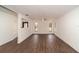 Open living area showcasing dark wood-look floors, freshly painted walls, and natural light at 6345 Hatcher Rd, Lakeland, FL 33811