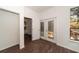 Bright room with wood-look tile flooring and windows for natural lighting and outdoor views at 6345 Hatcher Rd, Lakeland, FL 33811