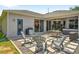Inviting backyard patio with a dining area and a hot tub perfect for outdoor entertaining and relaxation at 6542 Lake Pembroke Pl, Orlando, FL 32829