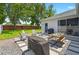 Charming backyard patio with outdoor seating, grill, and dining area for delightful gatherings at 6542 Lake Pembroke Pl, Orlando, FL 32829