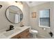 Modern bathroom featuring white countertops, round mirror, updated fixtures and vanity with stylish design at 6542 Lake Pembroke Pl, Orlando, FL 32829