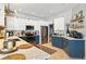 Stylish kitchen featuring stainless steel appliances, custom cabinetry, quartz countertops, and an open layout at 6542 Lake Pembroke Pl, Orlando, FL 32829