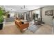 Inviting living room featuring tile floors, comfortable seating, and sliding glass doors to outdoor living at 6542 Lake Pembroke Pl, Orlando, FL 32829